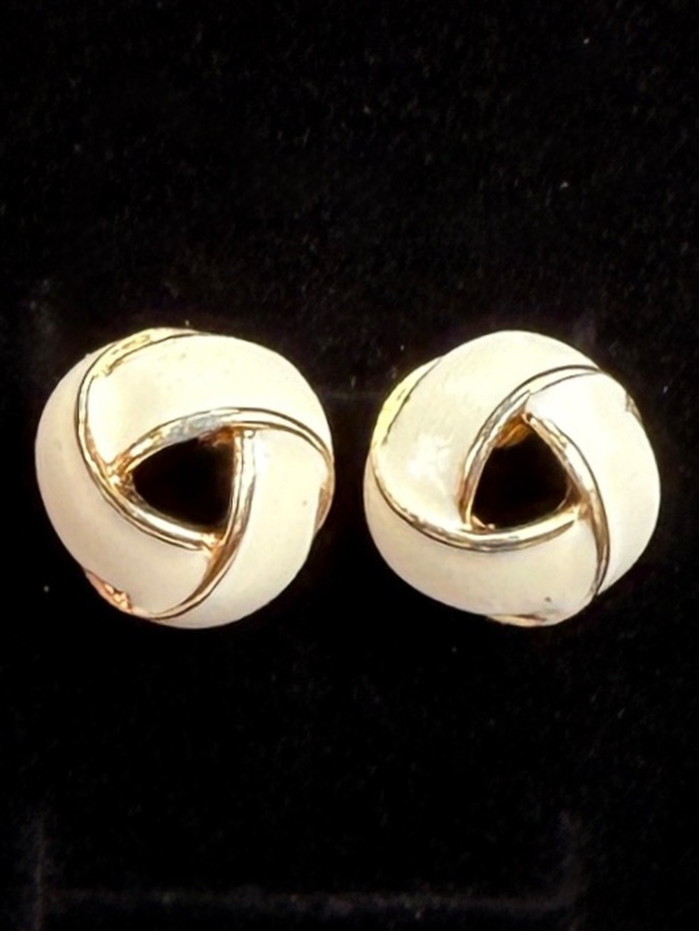 Vintage Monet  goldtone, cream enamel knotted vintage pierced earrings